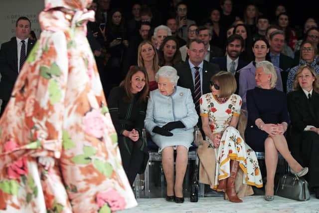 Queen Elizabeth sits with royal dressmaker Angela Kelly (fourth left) at London Fashion Week 2018 (Photo: Yui Mok/PA Wire)