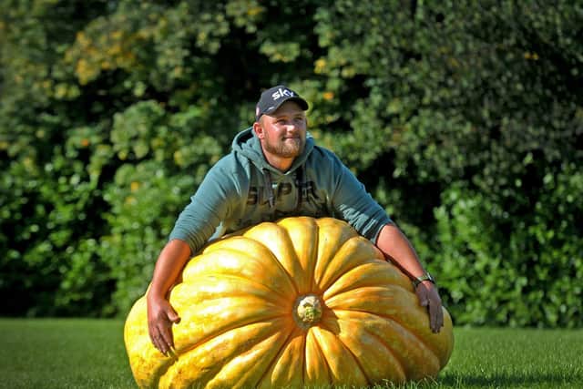 Richard Mann with his giant 291.7k pumpkin at the Harrogate Autumn Flower Show (Photo: Tony Johnson).