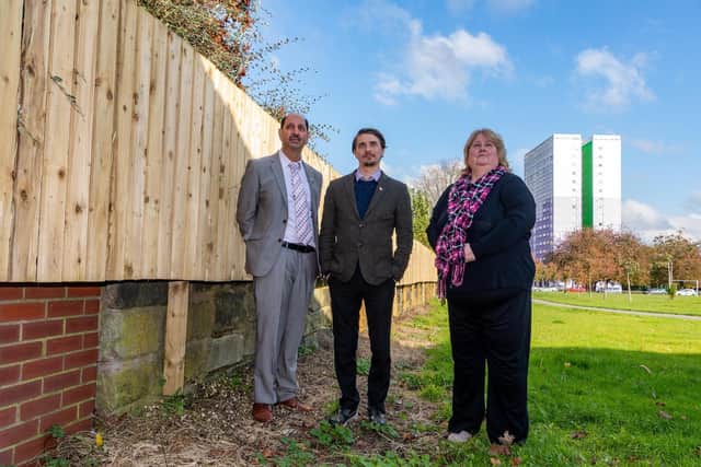 Cllr Mohammed Iqbal, Chair of West Yorkshire Police & Crime Panel, Cllr Paul Wray, and Sue Hewitt, Development Manager for St Peter's Court sheltered housing complex where the 50 metres of new fencing has changed life for elderly residents.