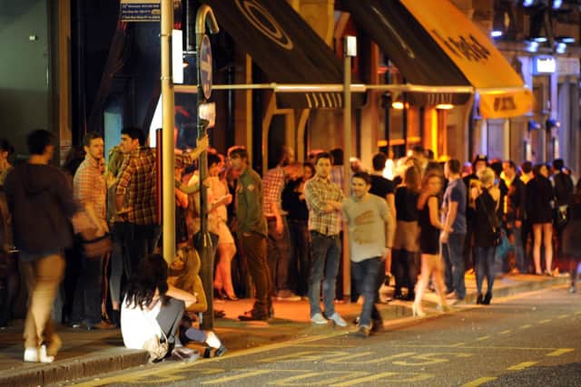 Revellers on Call Lane in Leeds at night. Picture: Mark Bickerdike