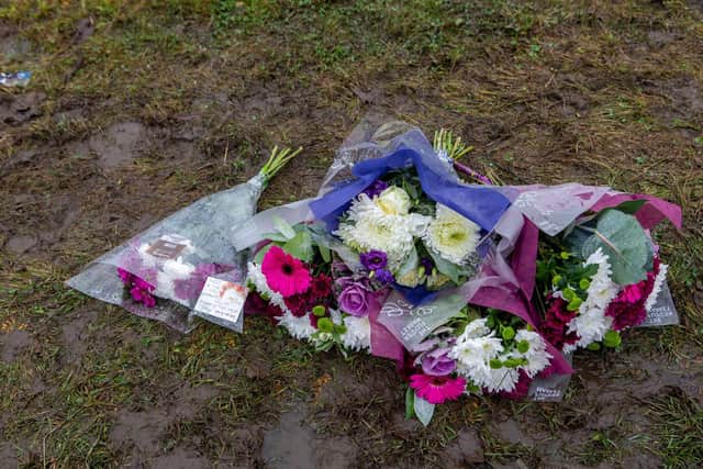 Floral tributes placed at the scene of the tragedy.