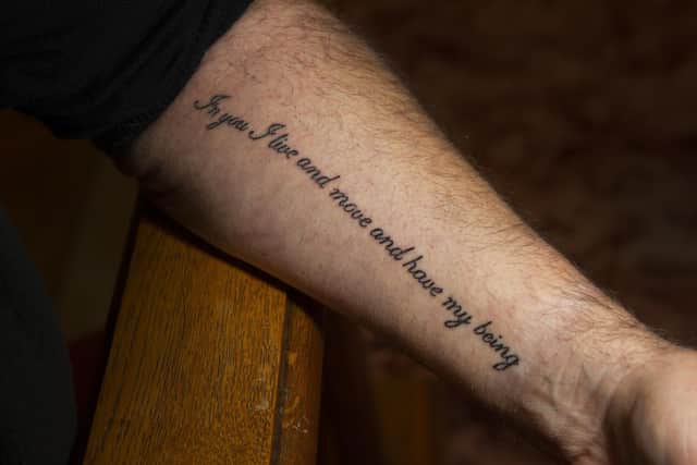 Father Andrew Myers shows his tattoo
Picture: Tony Johnson