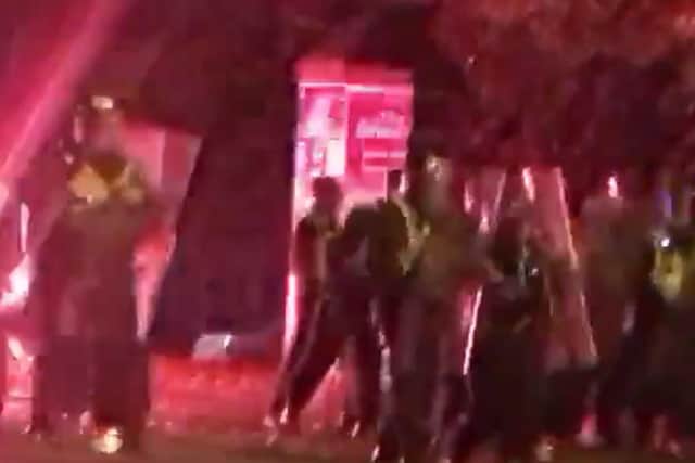Video footage shows fireworks and missiles being launched at riot police officers on Harehills Road (Photo: Radio Sangam)