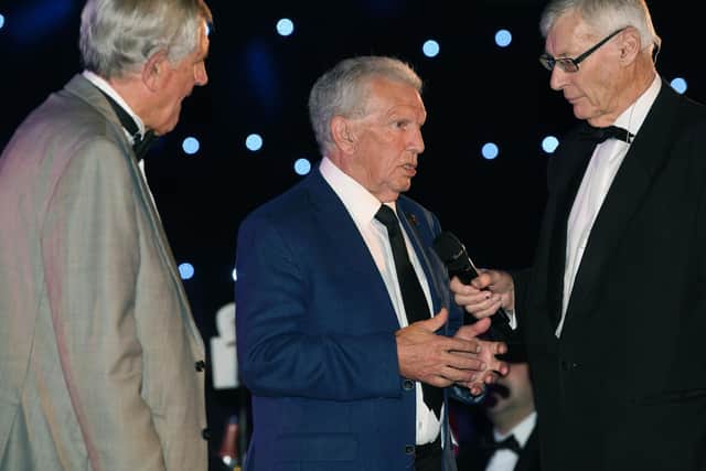 Giles speaking at the club's centenary dinner alongside ex team-mate Norman Hunter