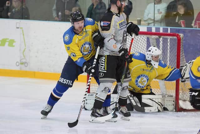 MR ADAPTABLE: Richard Bentham, left, tries to clear the crease in front of Sam Gospels net in the 6-4 win at Milton Keynes last month. Picture courtesy of Tony Sargent.