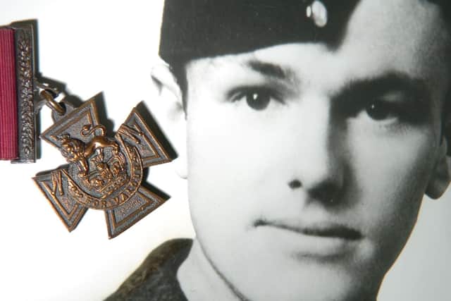 The Victoria Cross and an image of Arthur Aaron.