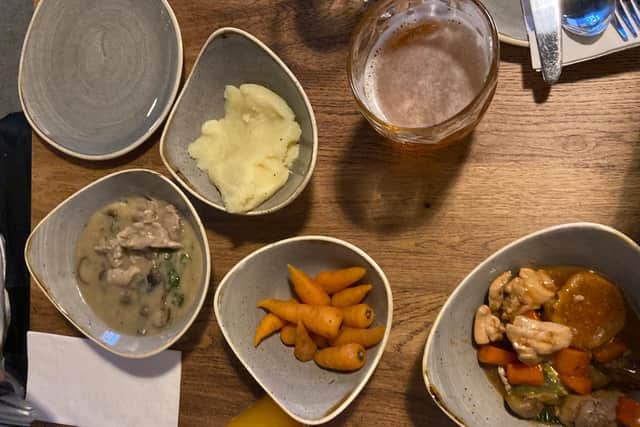 Two chicken stews, mashed potato and carrots at Stew & Oyster Calls Landing.