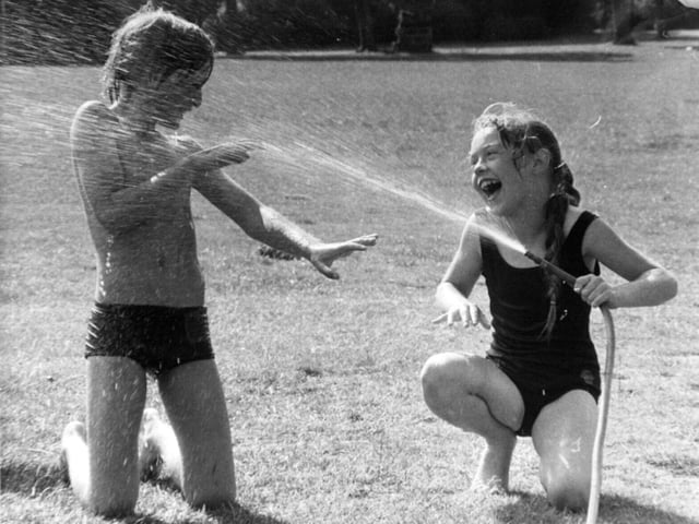 Joanne Bailiff and Charles Patrick from the summer Playscheme at Broad Lane Middle School enjoy fun in the sun.