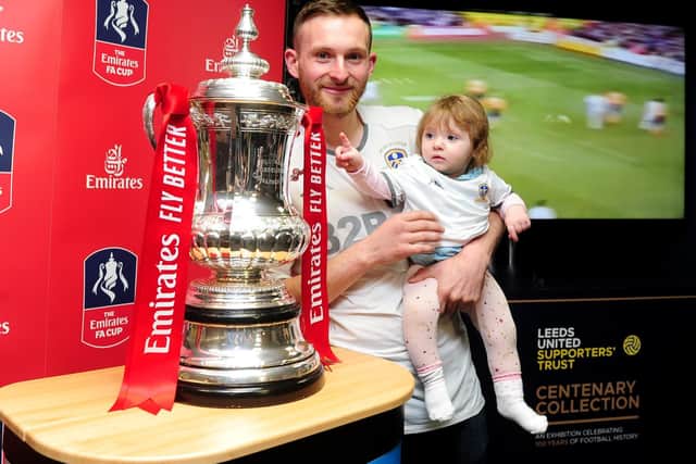 Dan Cole pictured with his daughter Daisy Cole, aged 8 months, with the Emirates FA Cup