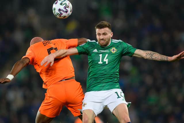 Dallas in action against the Netherlands at Windsor Park on Saturday, when he played four different positions (Pic: Getty)