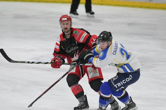 FIGHTING HARD: Liam Charnock, right, battles with Swindon's Neil Liddiard in a match hosts Leeds Chiefs went down 4-1. Picture courtesy of gw-images.com