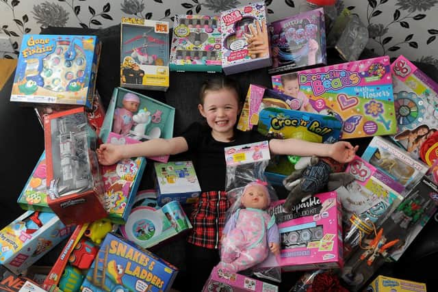 Halle Dolan with some of the gifts people have donated to Radio Aire's Mission Christmas toy appeal.