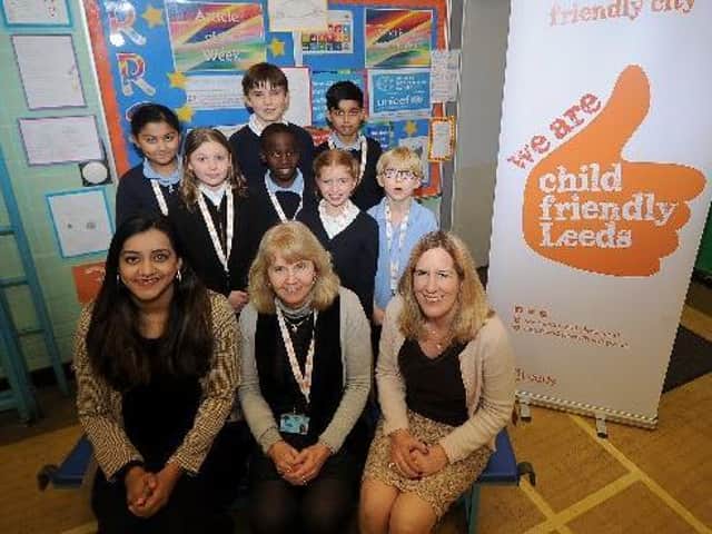 Pictured from left Coun Salma Arif, Headteacher Jenny Millington and Coun Fiona Venner, with children from Kerr Mackie Primary School in Roundhay, who are Unicef Champions, in front of a Rights Respecting School display in the school hall. Picture by Simon Hulme