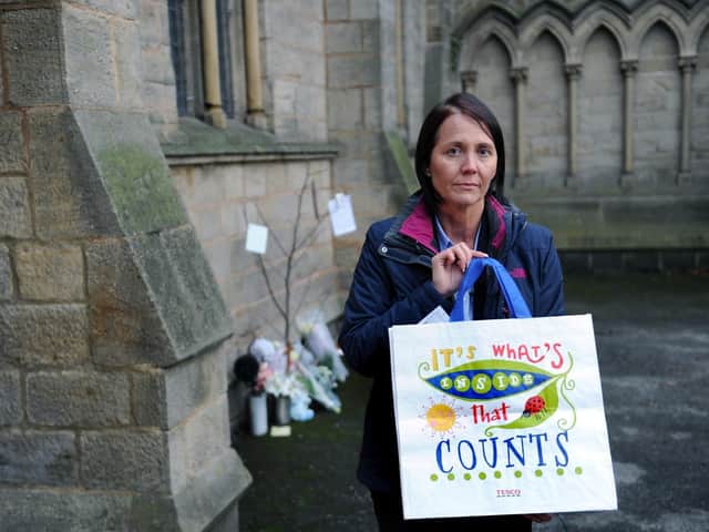 Detective Superintendent Nicola Bryar with a replica of the bag Baby Peter was found in.