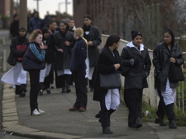 Pupils arrive for the school day at Matthew Murray.