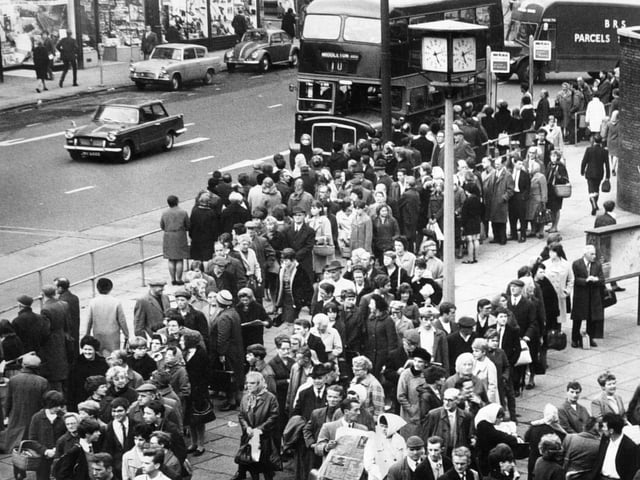There were long queues for buses - the number of which has been reduced by a ban on overtime - at the junction of The Calls and Vicar Lane. Pictured in October 1967.
