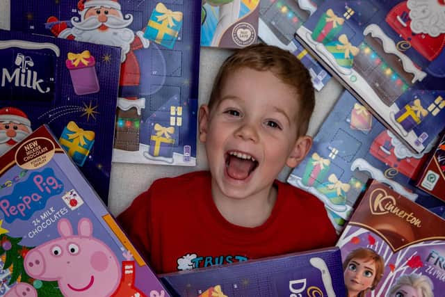 Finley Chapman with some of the advent calendars people have donated for Leeds Children's Hospital.
Photo: James Hardisty.