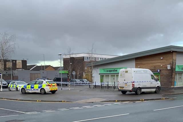 A police cordon is in place and the Co-op is closed until further notice