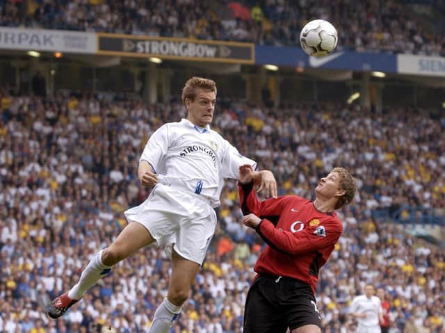 FORMER FAVOURITE: Centre-back Jonathan Woodgate towers above striker Ole Gunnar Solskjaer during the Premiership clash between Leeds United and Manchester United in September 2002. Photo by PAUL BARKER/AFP via Getty Images.