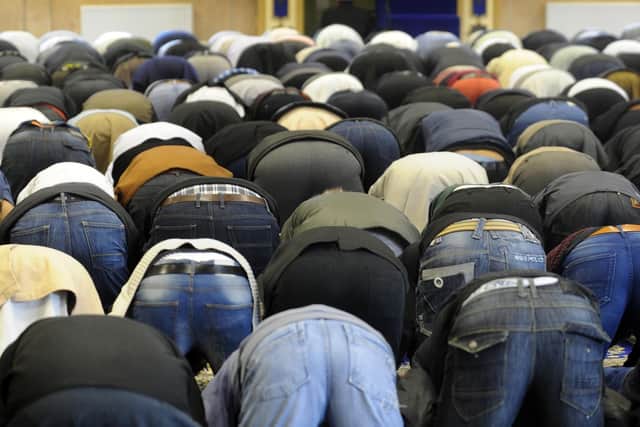 Worshippers at the Makkah Masjid Mosque, Burley, Leeds