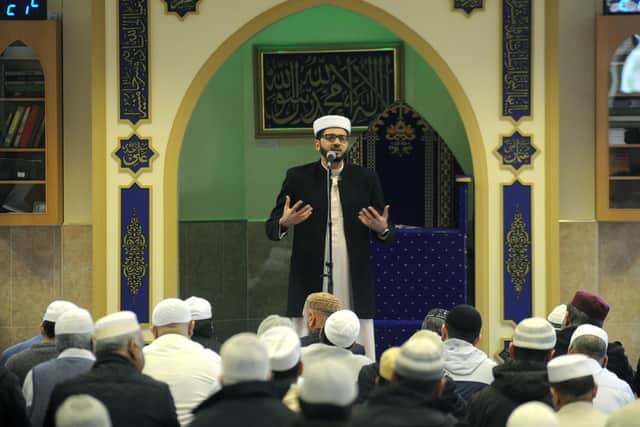 Iman Qari Asim leads a service at the Makkah Mosque.