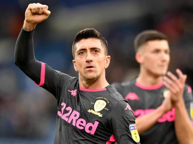 INTO THE BIG TIME: Leeds United Academy graduate Oliver Casey follows Pablo Hernandez and applauds the Whites' fans following the full-time whistle of Saturday's Championship success of Huddersfield Town in which the defender made his debut. Photo by Anthony Devlin/PA Wire.
