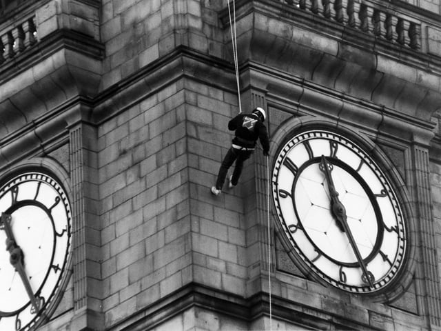 Simon Young abseils down Leeds Town Hall clock tower in November 1993, aiming to raise public awareness of local youth activity.
