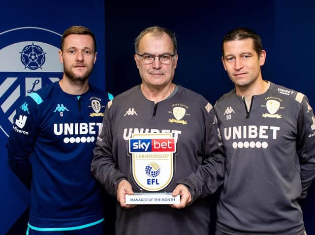 Leeds captain Liam Cooper, left, and fitness coach Benoit Delaval, right, flank Championship Manager of the Month Marcelo Bielsa (Pic: Sky Bet)