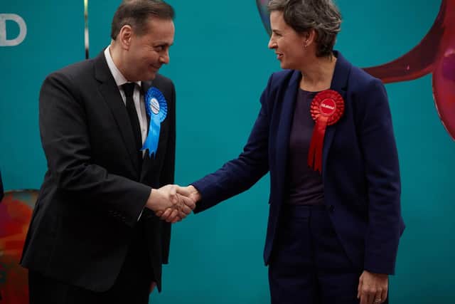 Ms Creagh shakes hands with the winning Conservative candidate, Imran Ahmad-Khan.