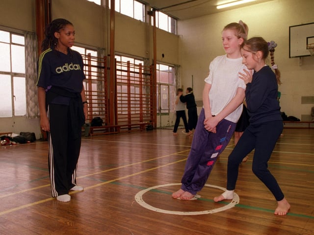 Pam Johnson, of the Phoenix dancers, works with Nicola Platts, 12, left, and Nicola Sanderson, 12, at Parklands Girls' High School.