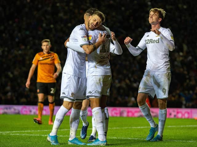 MARCHING INTO FIRST: Mateusz Klich, Helder Costa and Patrick Bamford celebrate Leeds United's opener via a Jordy de Wijs own goal in Tuesday evening's 2-0 win against Hull City at Elland Road. Picture by Bruce Rollinson.