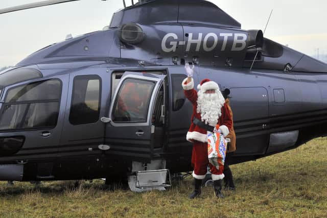 Santa Claus arrives by helicopter