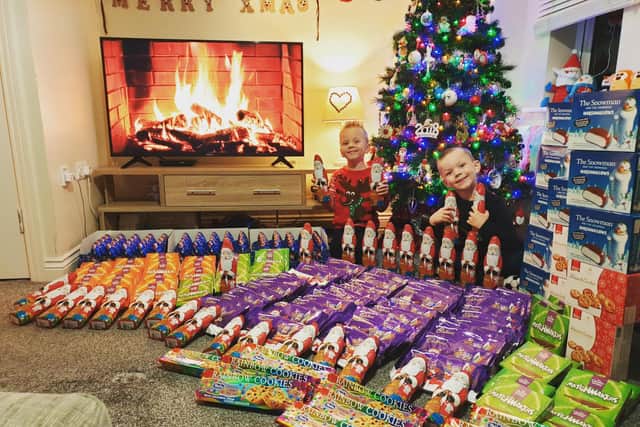 Alfie and Joey Wormald bought hundreds of selection boxes and chocolate reindeers for children in Leeds whose families will be using food banks over Christmas