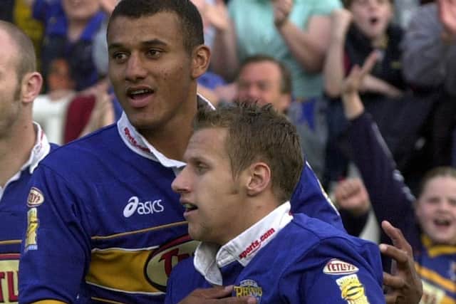 Mark Calderwood congratulates Rob Burrow on scoring on his full debut for Leeds Rhinos against Warrington in 2001. Picture: Steve Riding.