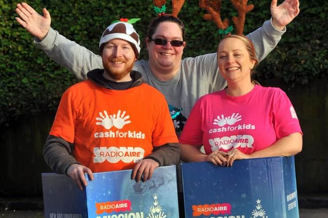 Pictured (left to right) are  Eddie Thompson,  a Cash for Kids Charity Ambassador,  Allison Green,  a Barclays  volunteer and  Lauren Procter, a Cash for Kids  charity  executive at the Cash for Kids  depot  in Leeds.