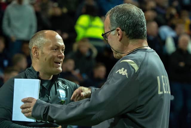 WE'LL MEET AGAIN: Preston North End boss Alex Neil and Leeds United head coach Marcelo Bielsa embrace before October's 1-1 draw at Deepdale. Picture by Bruce Rollinson.