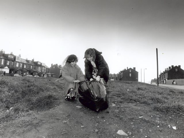 Syeda Begum and Danielle Ford, both nine at the time, help clear up land near their school, Greenmount Primary in Beeston.
