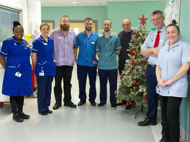 Leeds Teaching Hospitals NHS Trust chief executive Julian Hartley pictured (second from right) with the team at Leeds liver unit.