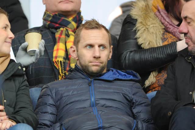 Rob Burrow watches the Rhinos v Wakefield game from the stands.