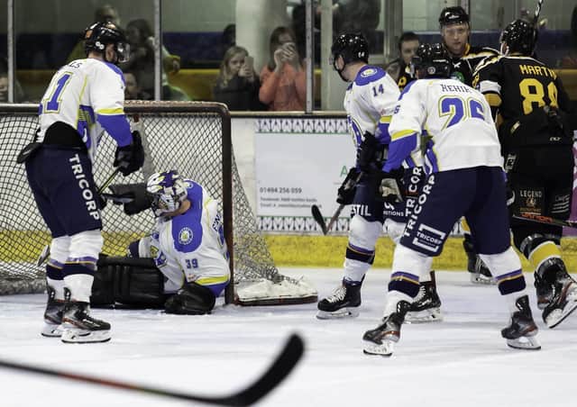 DOWN AND OUT: Leeds Chiefs' replacement netminder Miles Finney is slumped in his goal during Sunday night's 11-1 defeat at Bracknell Bees. Picture courtesy of Kevin Slyfield.