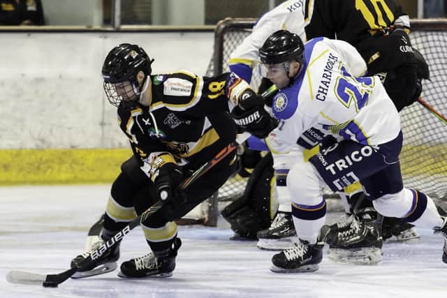 TOUGH NIGHT: Liam Charnock battles for puck possession on a testing night against Bracknell Bees. Picture courtesy of Kevin Slyfield.