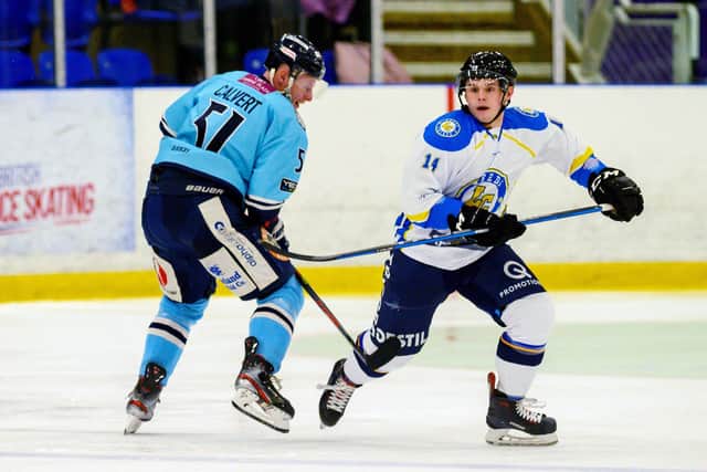 Ashley Calvert, then at Sheffield Steeldogs, battles with Leeds Chiefs' Lewis Baldwin during the last meeting at Ice Sheffield between the two. Picture: Bruce Rollinson.