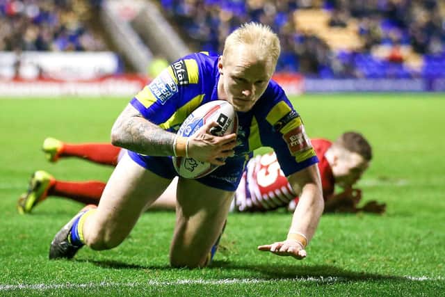 Rhys Evans scores a try for Warrington.