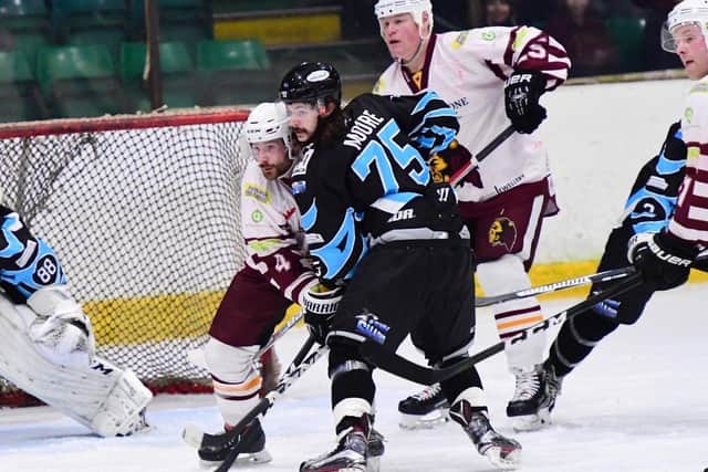 Steven Moore battles with future boss Sam Zajac during an NIHL clash between Whitley Bay and Solway Sharks last season. Picture courtesy of Colin Lawson.