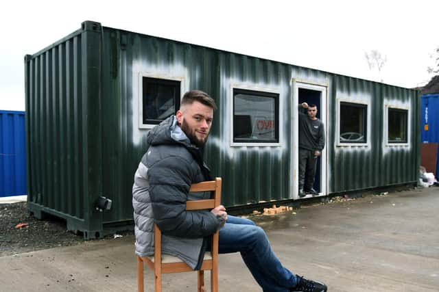 Hayden Lee Jessop with the shipping container, which he is converting into a temporary home for the homeless. Aiden Ramsdale, in the background, is a current service user of Hayden's charity Vulnerable Citizen Support Leeds