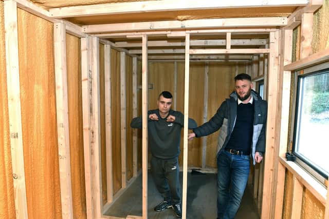 Hayden Lee Jessop, right, inside the shipping container, which he is converting into a temporary home for the homeless. Aiden Ramsgate, left, is a current service user of Hayden's charity Vulnerable Citizen Support Leeds