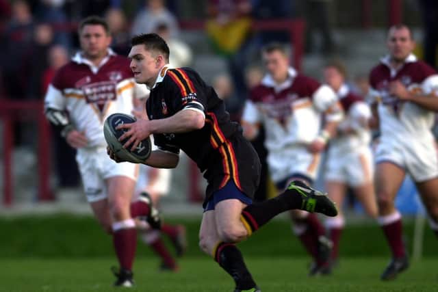 PROVING IT: Danny Brough looks up to pass on the ball while playing for Dewsbury Rams against Batley Bulldogs back in 2003.