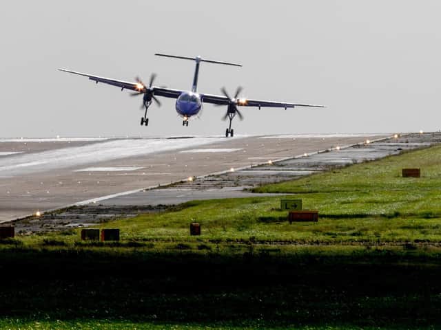 A Flybe aircraft landing at Leeds Bradford Airport
