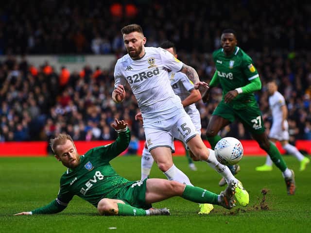 TOUGH DAY: Leeds United's Stuart Dallas is tackled by Sheffield Wednesday's Barry Bannan. Picture: Jonathan Gawthorpe.
