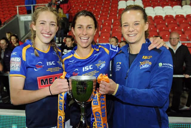 Caitlin Beevers, Rhinos captain Courtney Hill and club captain Lois Parsell celebrate winning last year's Women's Super League Grand Final. Picture: Steve Riding.